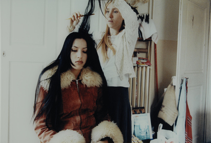 Sonja and Linda Combing Their Hair