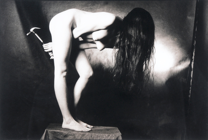 Nude with a hammer