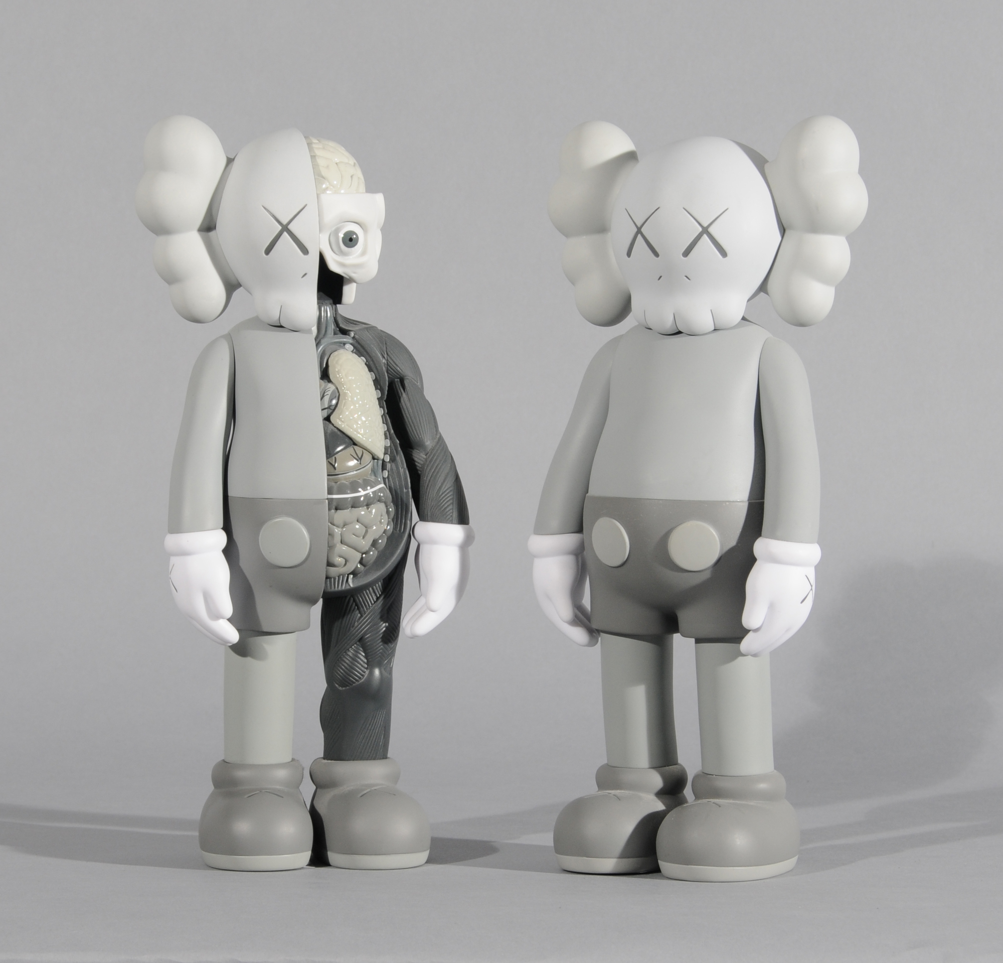 KAWS (Brian Donnelly), 2 multiples: Companion (Grey); Companion Flayed (Grey)